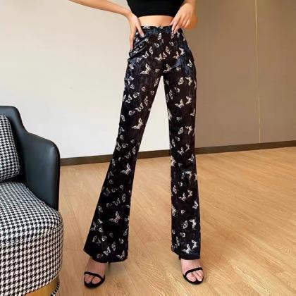 Butterfly printed flared trousers, ..