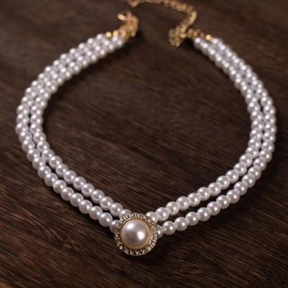 Vintage, double pearl clavicle chai..